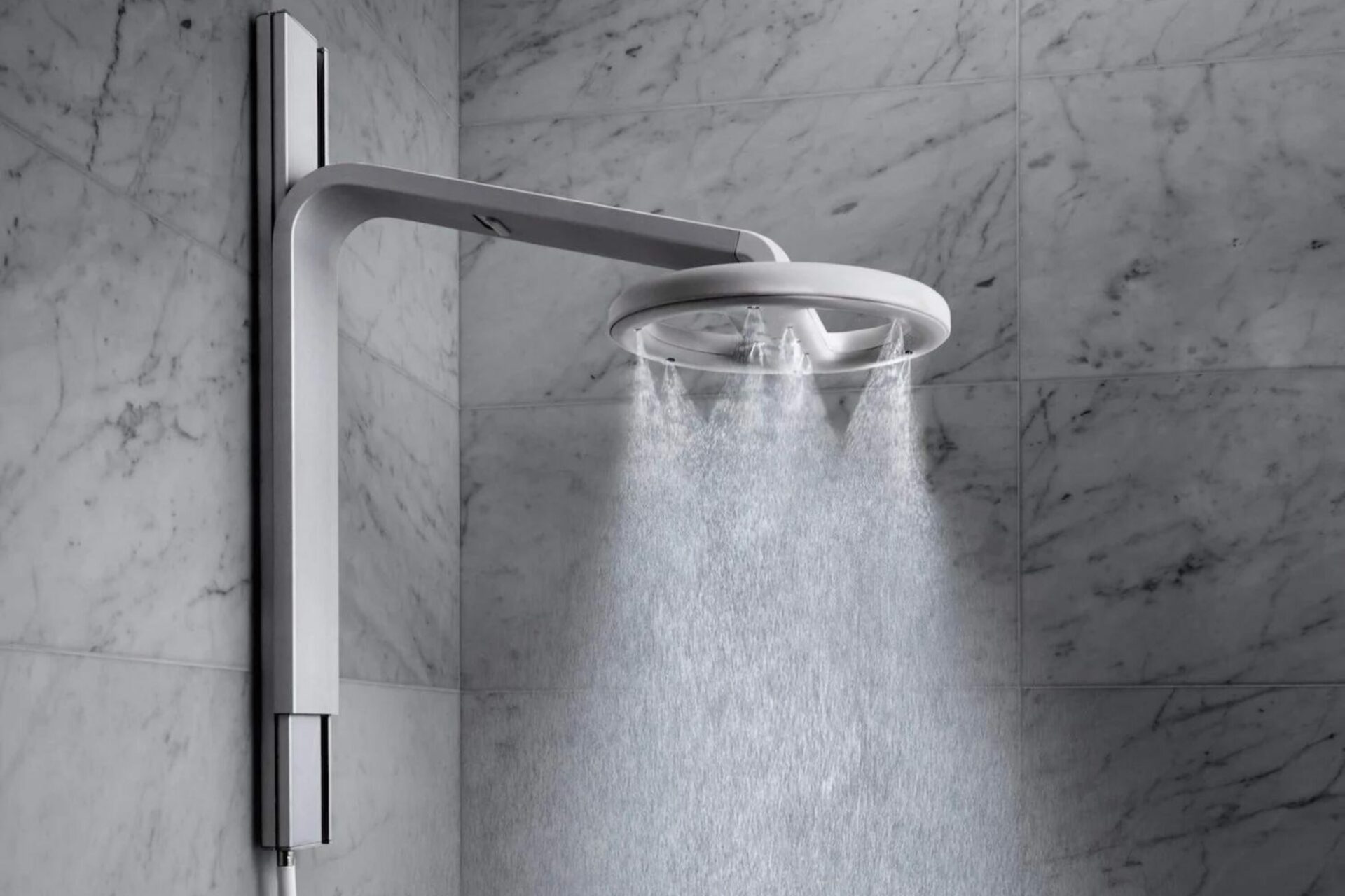 Nebia shower. Click to read the article 'Tim Cook and Eric Schmidt stripped down to try this new kind of shower head and wound up investing.'